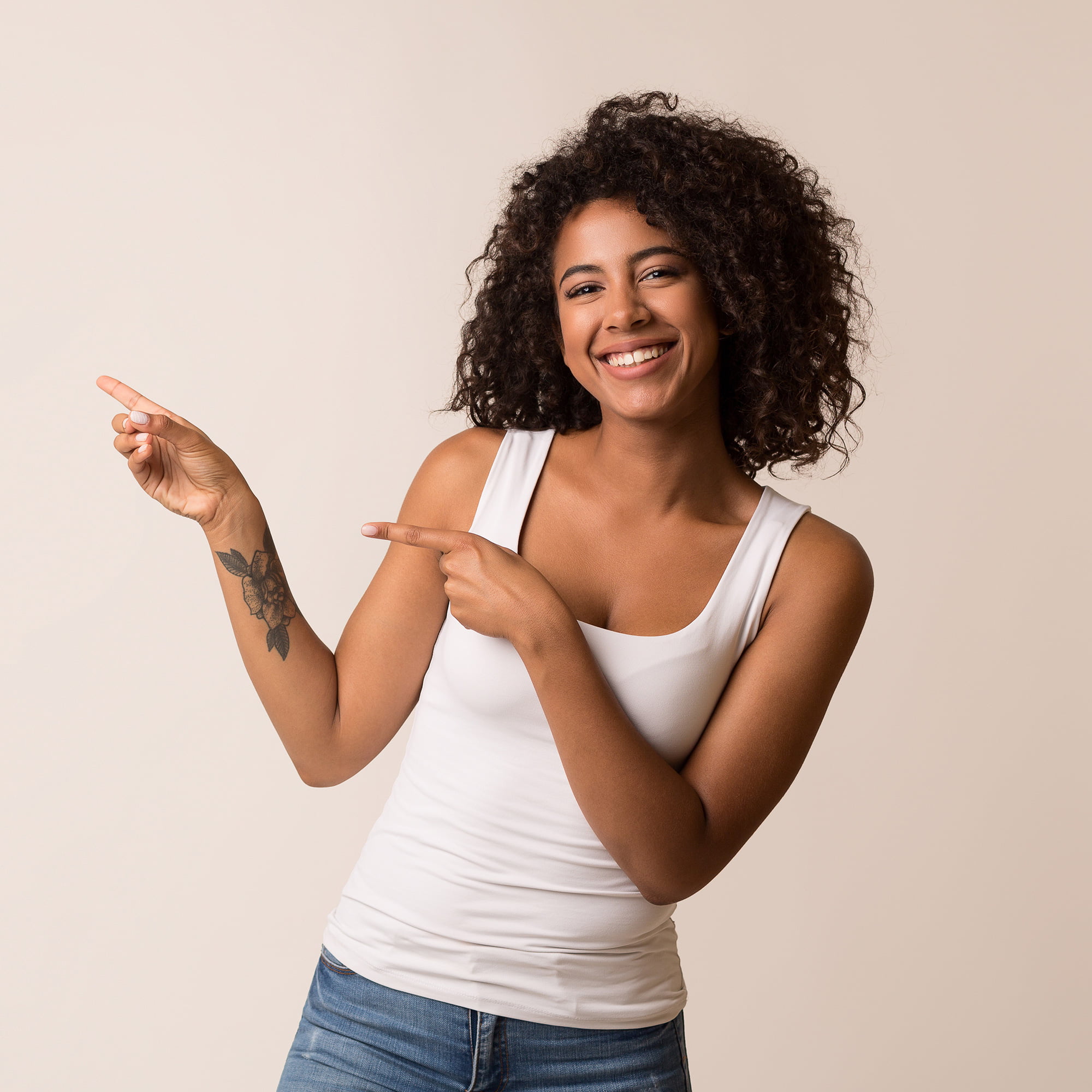 Curly hair woman pointing left | LIIV Medical in Portsmouth, NH