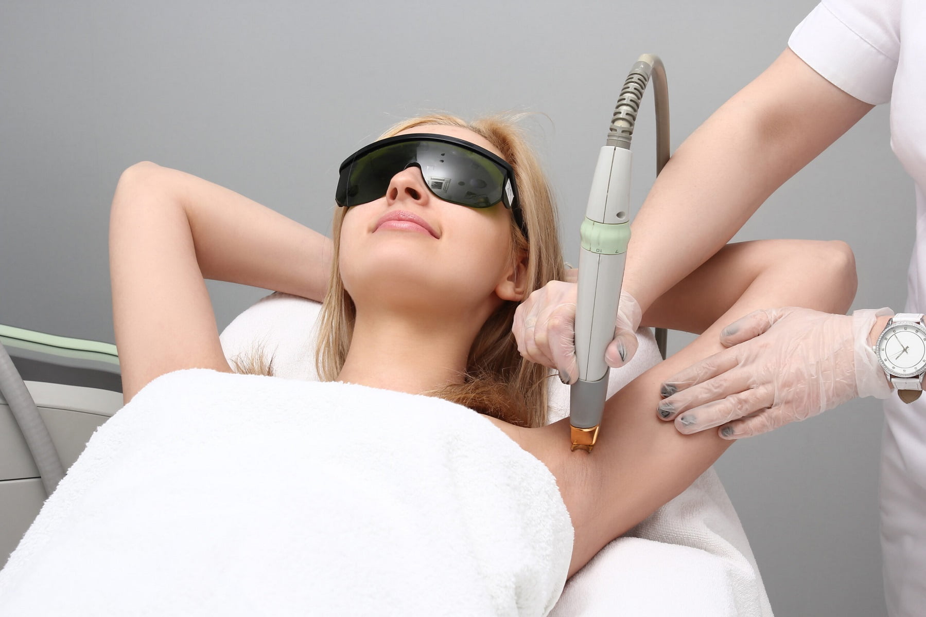 Blonde woman having underarm Laser hair removal treatment | LIIV Medical in Portsmouth, NH