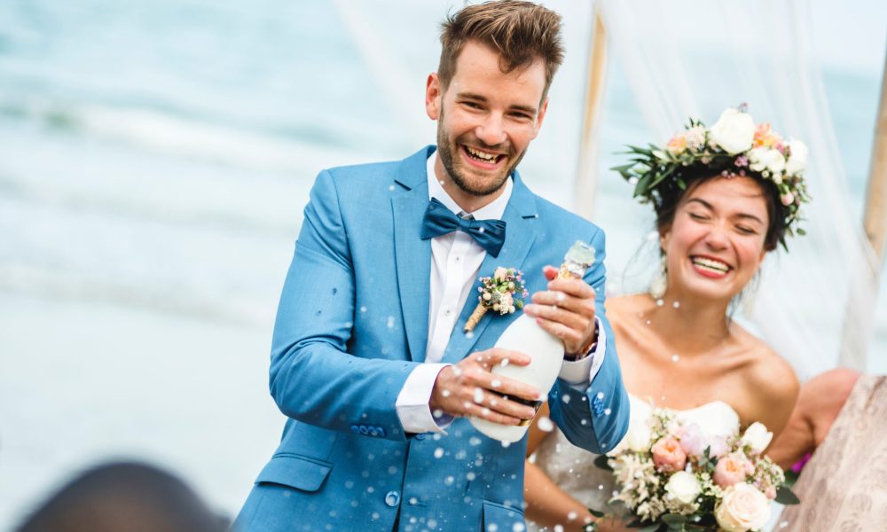 Young couple in a wedding ceremony at the beach