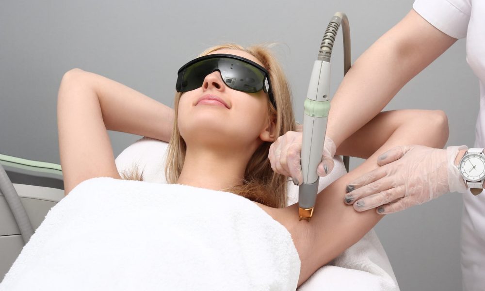 Blonde woman having underarm Laser hair removal treatment | LIIV Medical in Portsmouth, NH